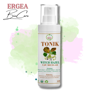 White spray bottle labeled TONIK Witch Hazel Ujë Micelar with ERGEA Bio Care logo, set against pastel paint splash backdrop.