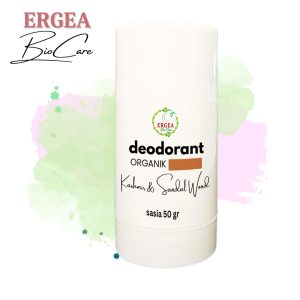 White cylindrical Ergea Bio Care organic deodorant bottle labeled 'deodorant ORGANIK Kashmir & Sandal Wood' with 50 g, set against pastel watercolor background.